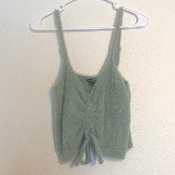 100% Nylon. You can untie the string in front. Never worn. No tags. - Picture 1 of 2